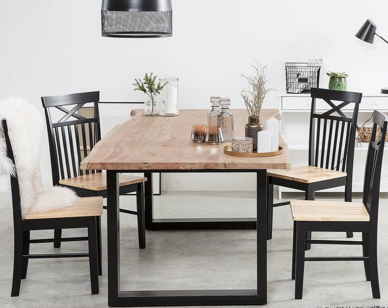 Six seater dining table made of solid acacia wood and iron